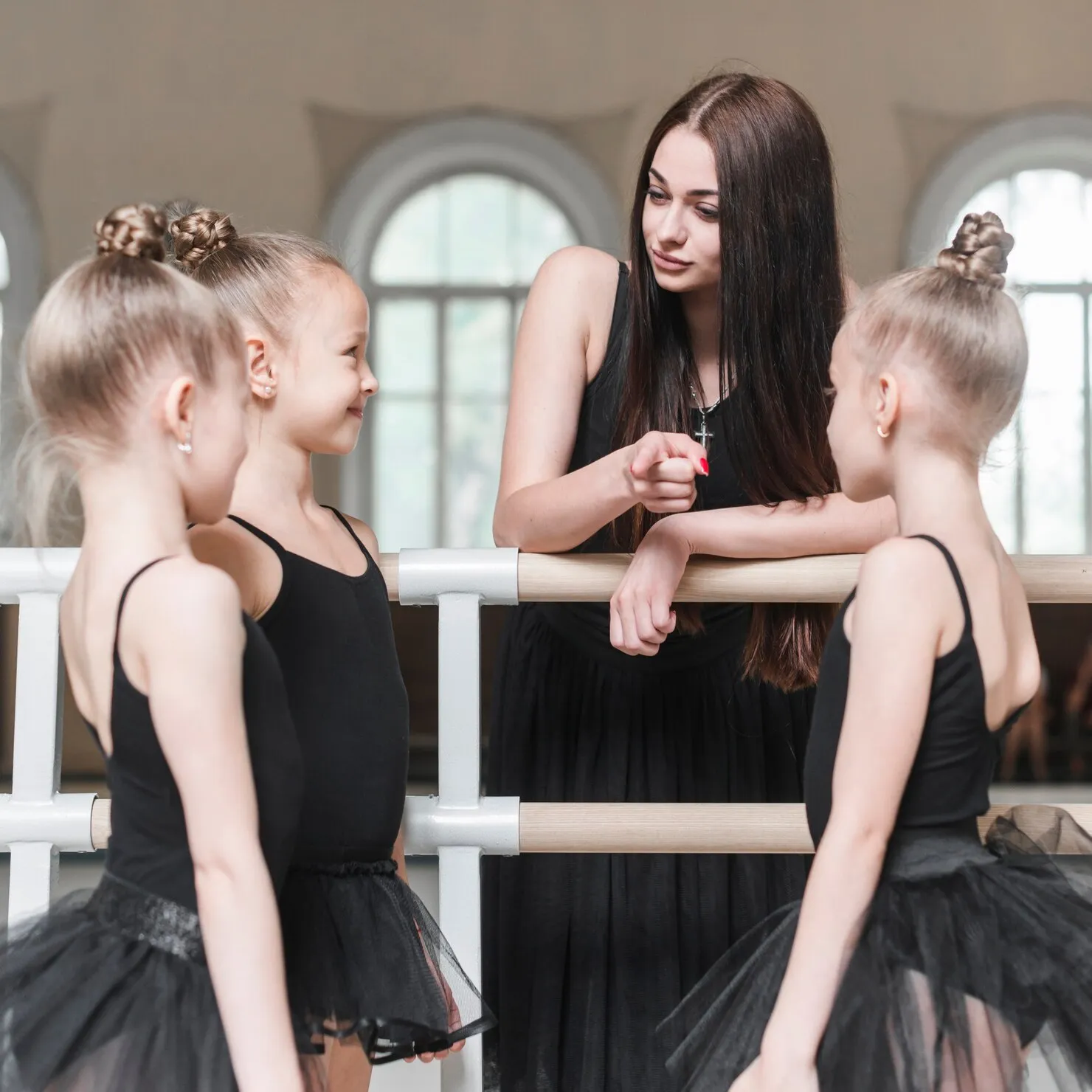 teacher-giving-instruction-her-ballet-girls-dance-studio_23-2147856599_JPQ1