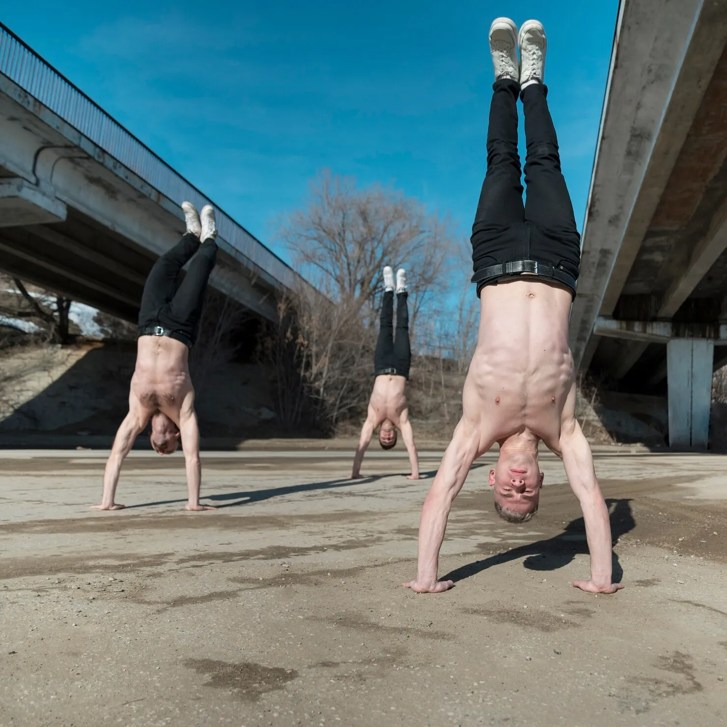 three-shirtless-hip-hop-performers-standing-their-hands_23-2148496967_2V70
